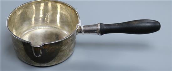 A 19th century French 955 standard white metal large brandy? pan, with ebonised handle, 13.5 oz.